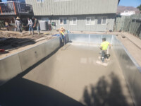 K.Wind Pools 7 putting in floor of Lorrie and Deans pool